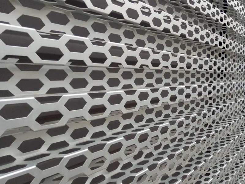 corrugated perforated panels are installed as building cladding