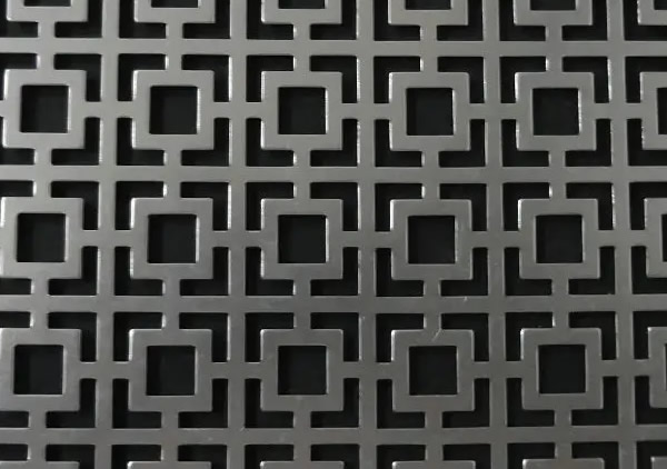 a piece of stainless steel perforated plate with square decorative holes