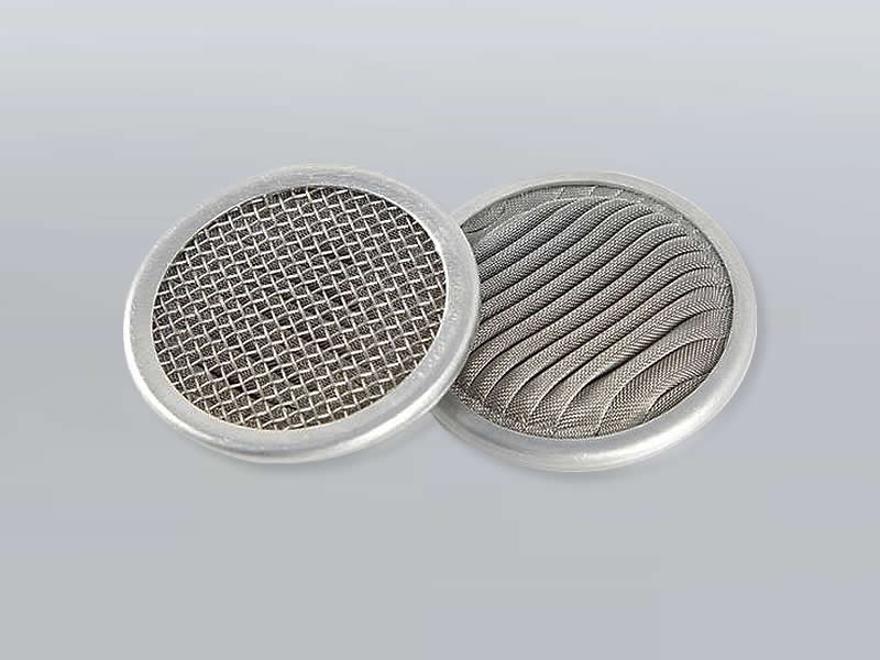 two stainless steel pleated extruder screens with rim binder