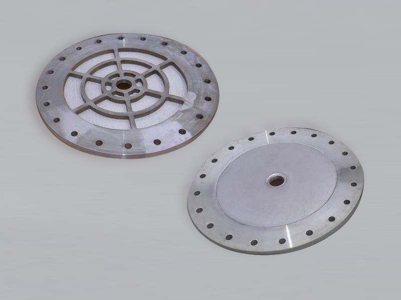 two sintered filter plates with flanges and center installation holes