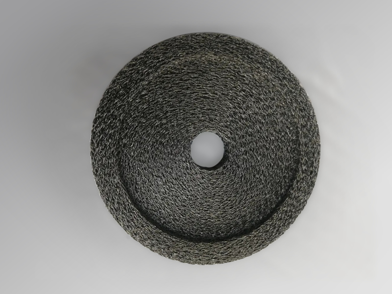 A special round shaped compressed knitted mesh pad made in SS304, with a center hole and top edge