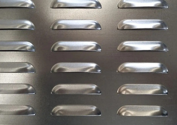 a piece of stainless steel perforated plate with ventilation louver holes