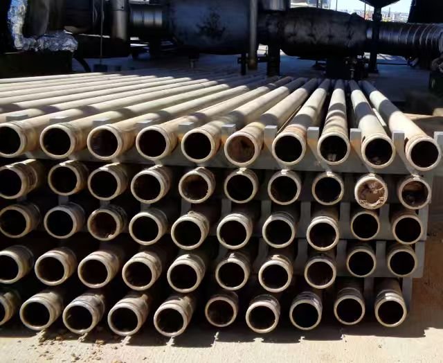 Rows of porous metal filter tubes returned after use