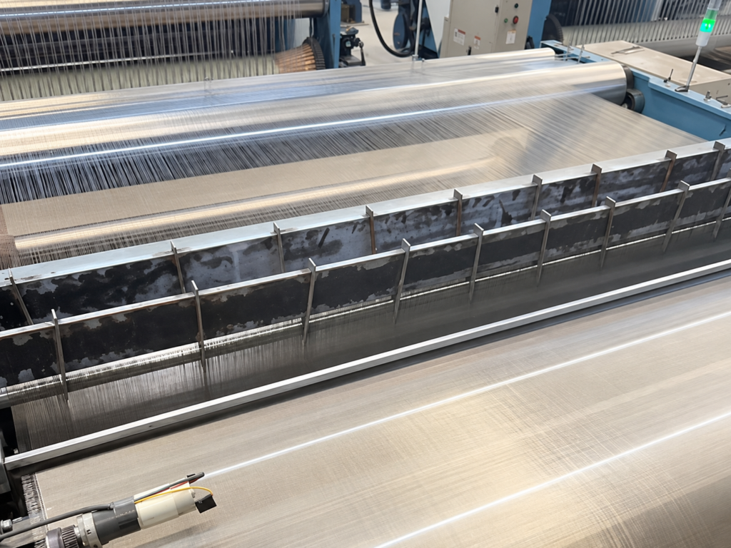 Weaving 40 mesh nickel wire mesh on a loom