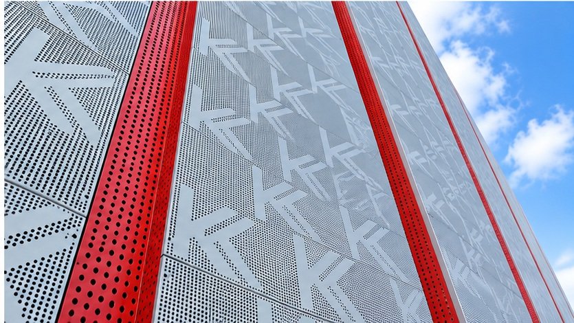 Architectural perforated metal facade illustration with patterned panels and red vertical framing
