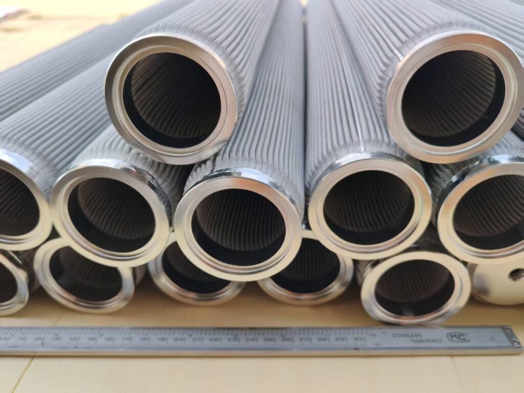 Open ends and pleated mesh surfaces of stainless steel filter cartridges