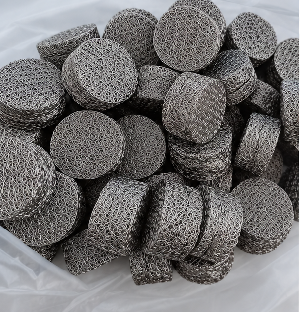 Compressed knitted wire mesh discs and cylinders with visible wire networks