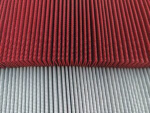 Pleated mesh support over red and light colored filter media