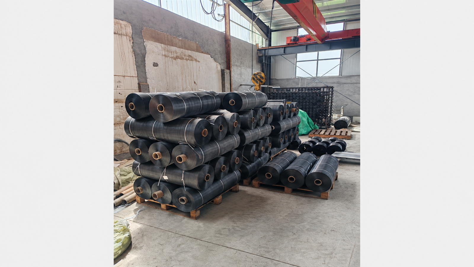Uncoated woven wire mesh rolls awaiting epoxy powder coating