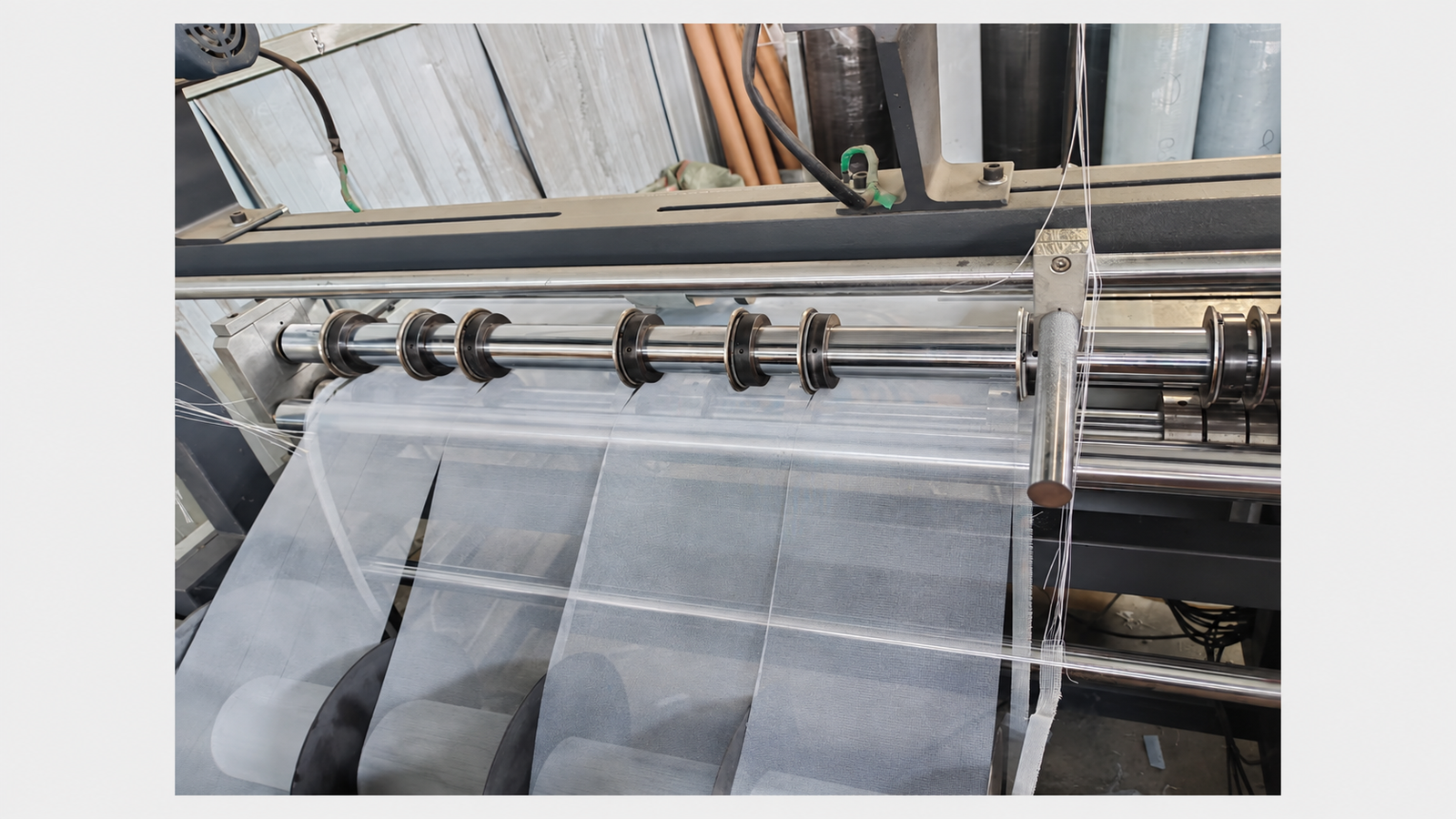 Slitting woven wire mesh into narrow strips