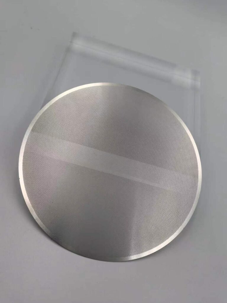Circular photo etched filter disc with a solid outer rim