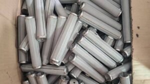 Semi-finished fine-mesh cylinders with seams and end rings.