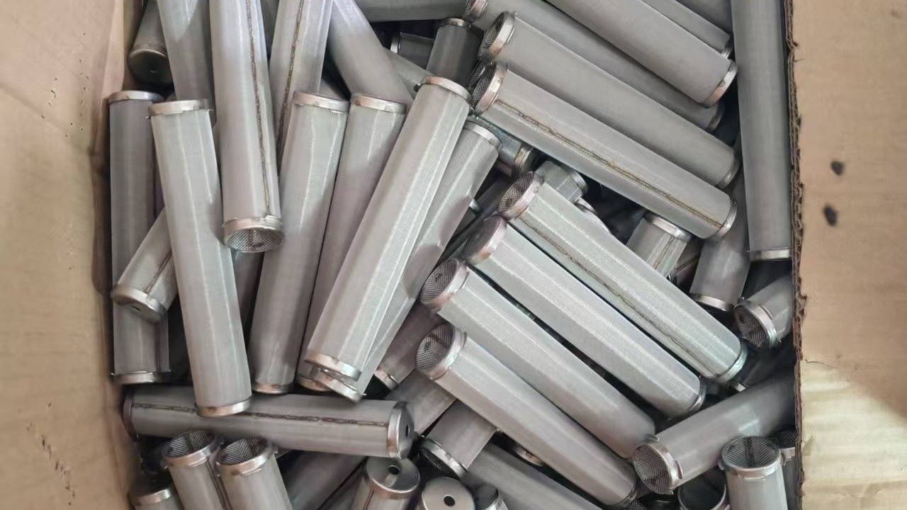 Semi-finished fine-mesh cylinders with seams and end rings.