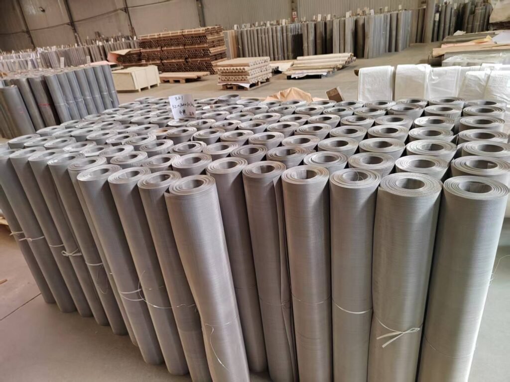 Rows of woven wire mesh rolls